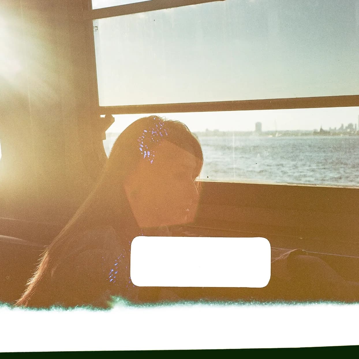 A warm silhouette against a ferry window.