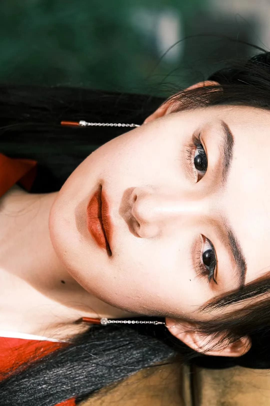 A reclining close portrait in warm light.