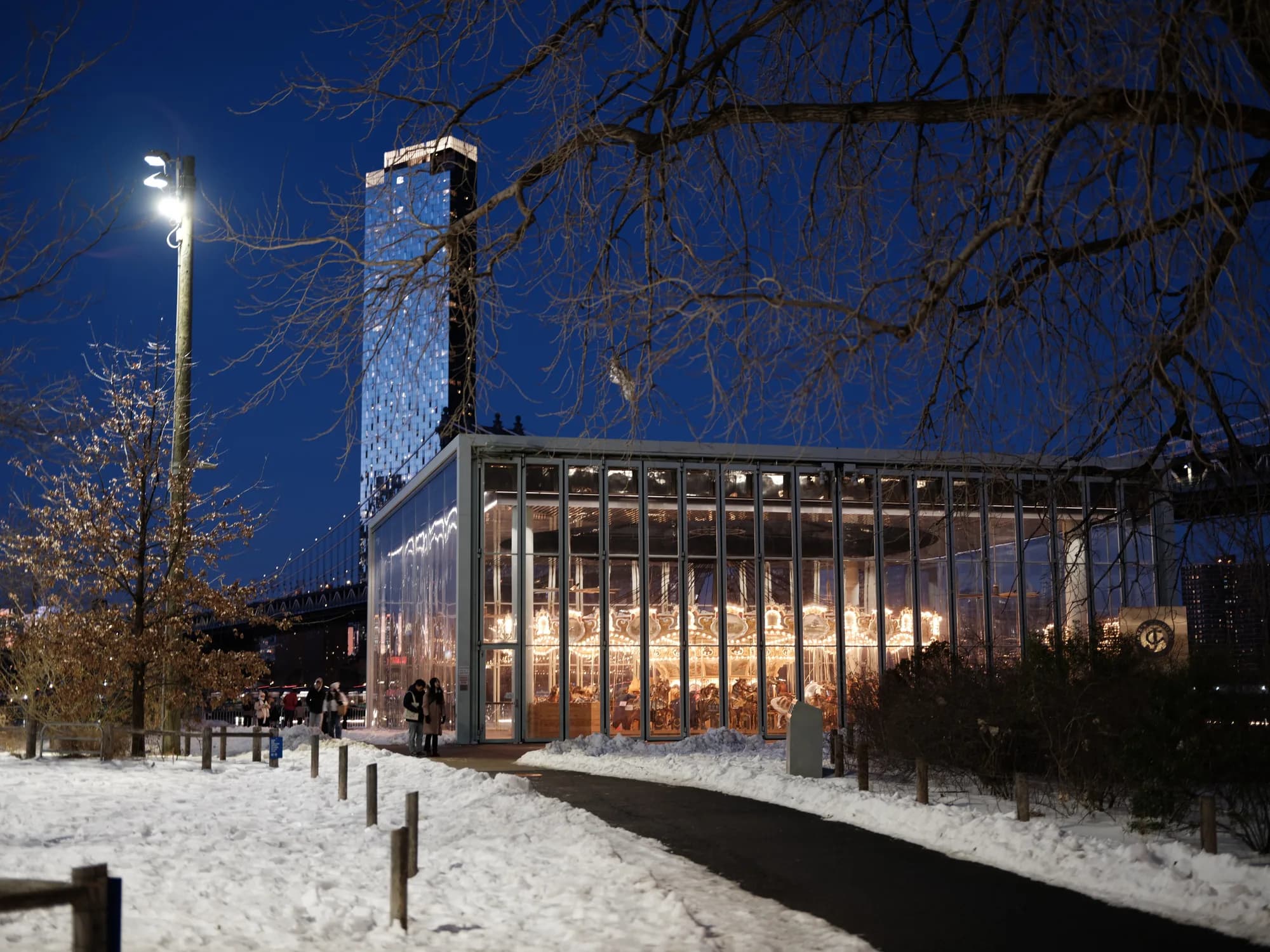 A glass building under deep blue winter sky.